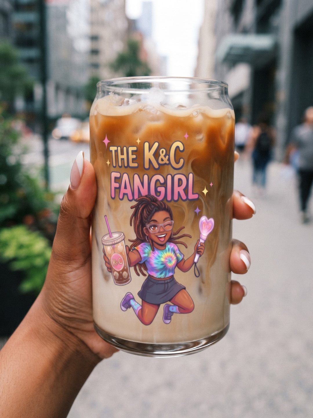 Closeup view of hand holding The K&C Fangirl 16oz can shaped glass